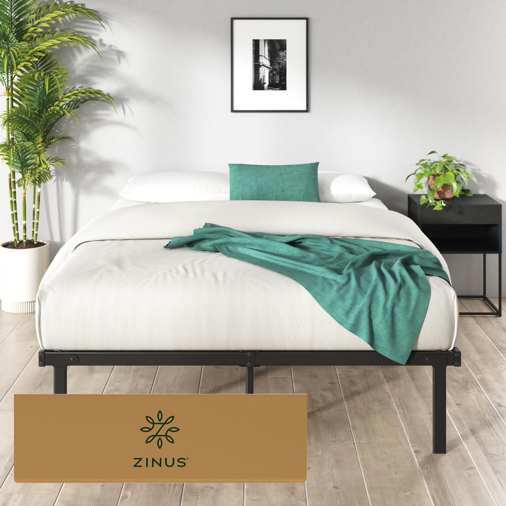 Zinus Caleb bed frame with a mattress, bedding, and storage boxes underneath.