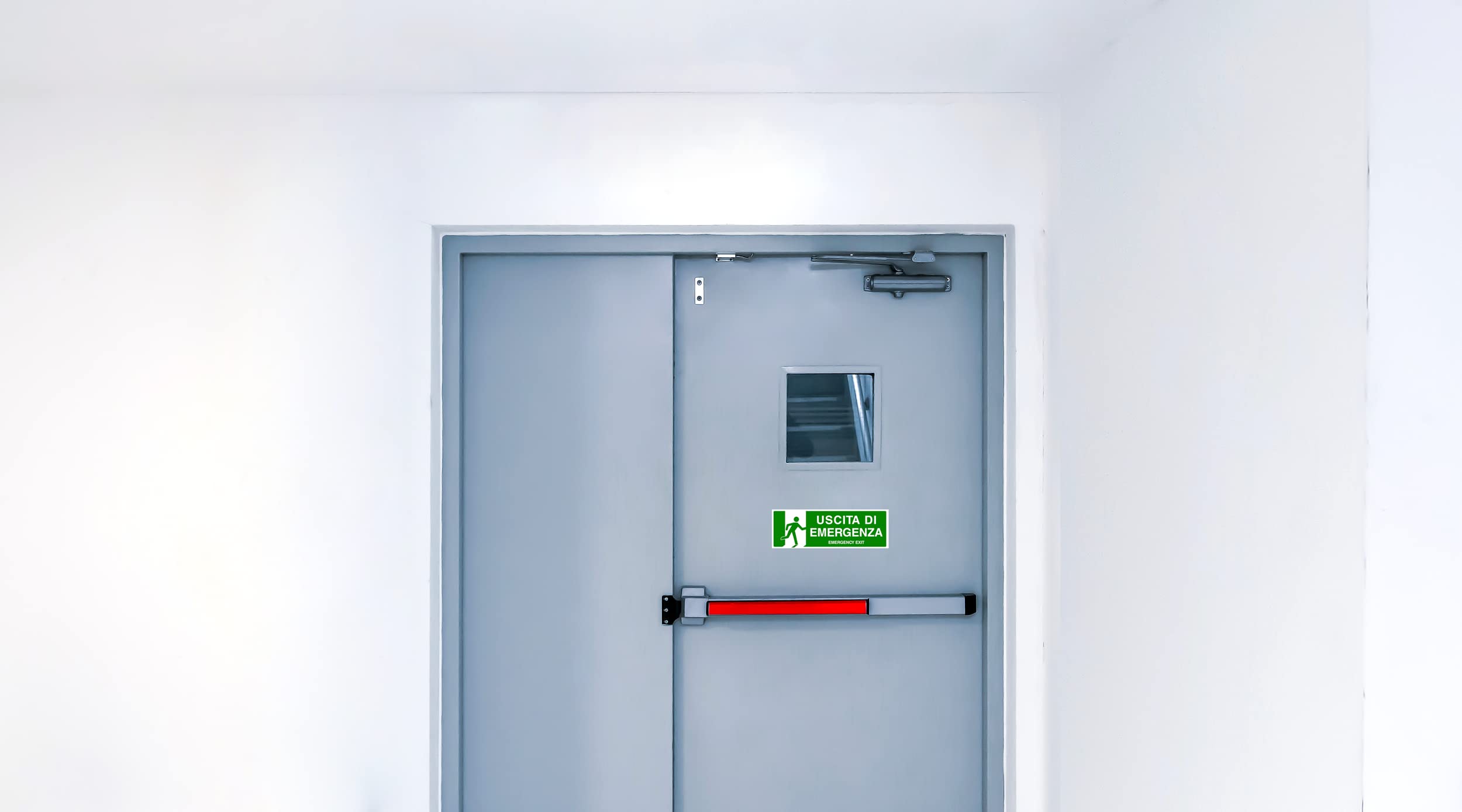 2 Adesivi USCITA DI EMERGENZA, Mis: 30x10 cm, in PVC Morbido, laminato anti UV, Cartello uscita di sicurezza, in Italiano e inglese, 2 pz
