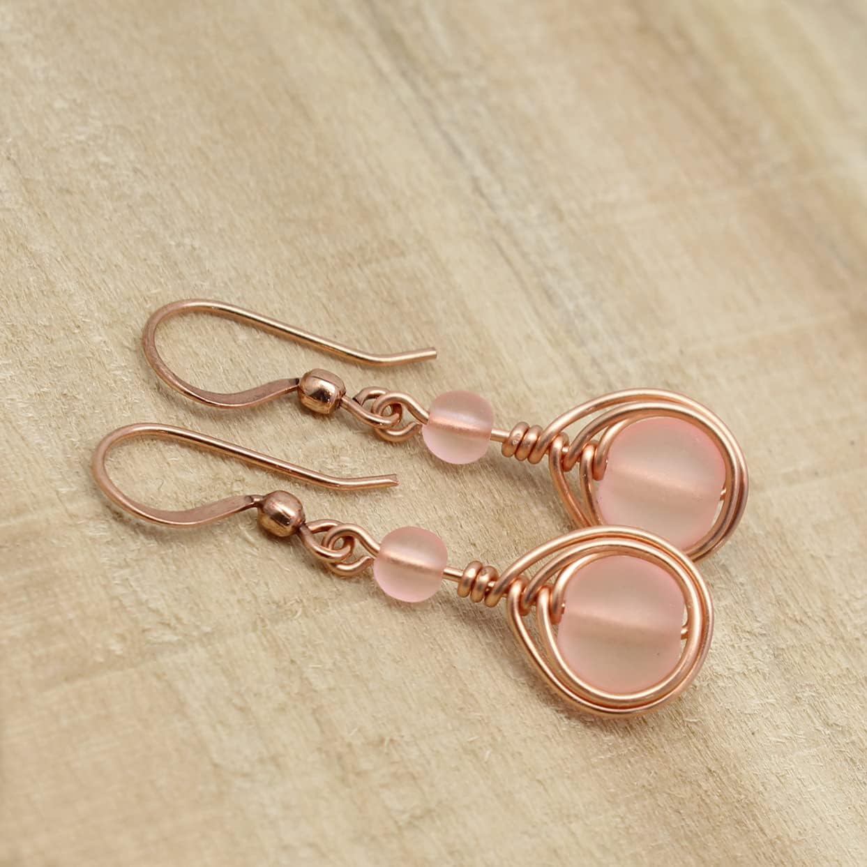 Pillar of Salt Studio Handcrafted Earrings Bright Copper and Sea Glass Wire Wrap Teardrop (Pale Pink, 1" drop)