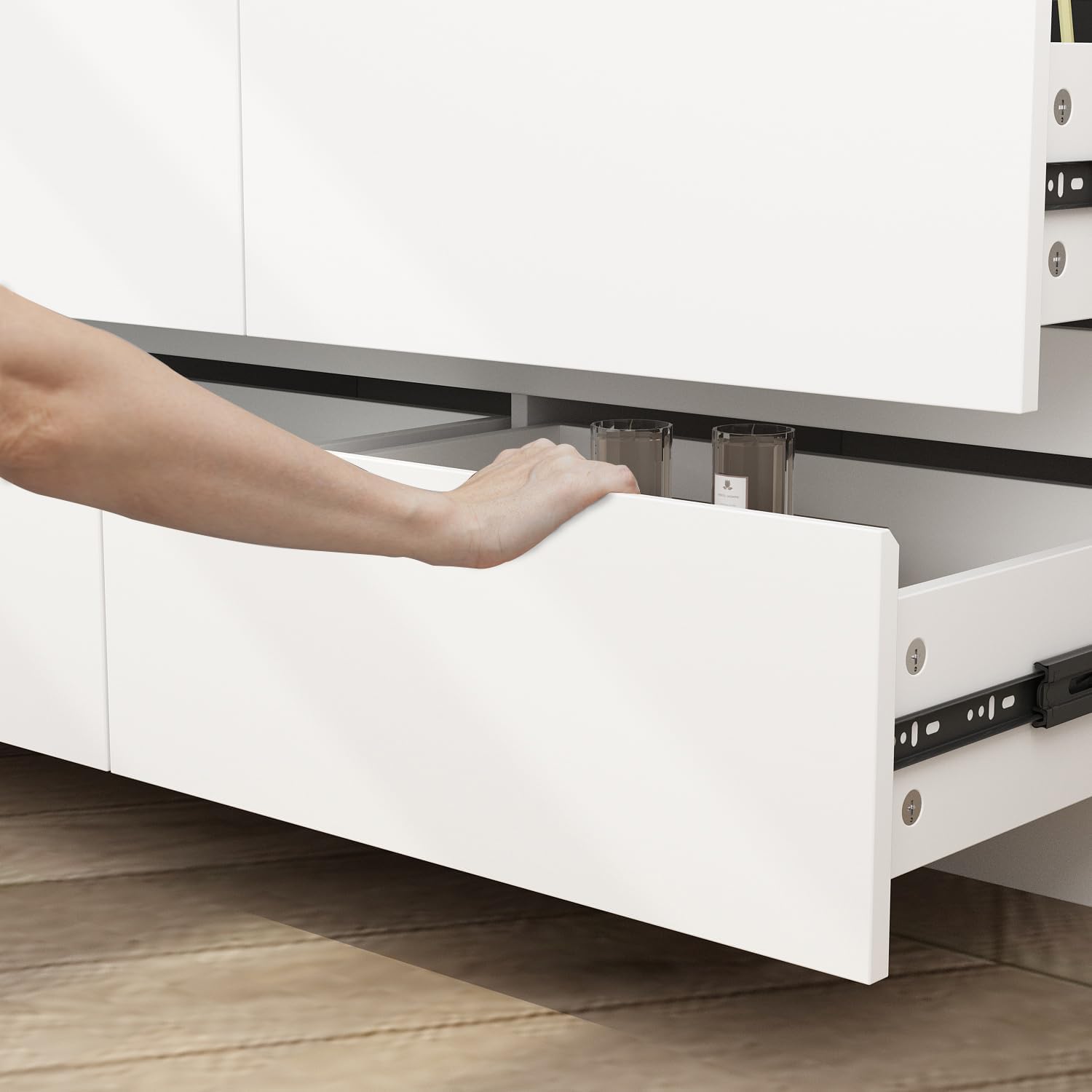 Hand opening a handle-free drawer on the dresser