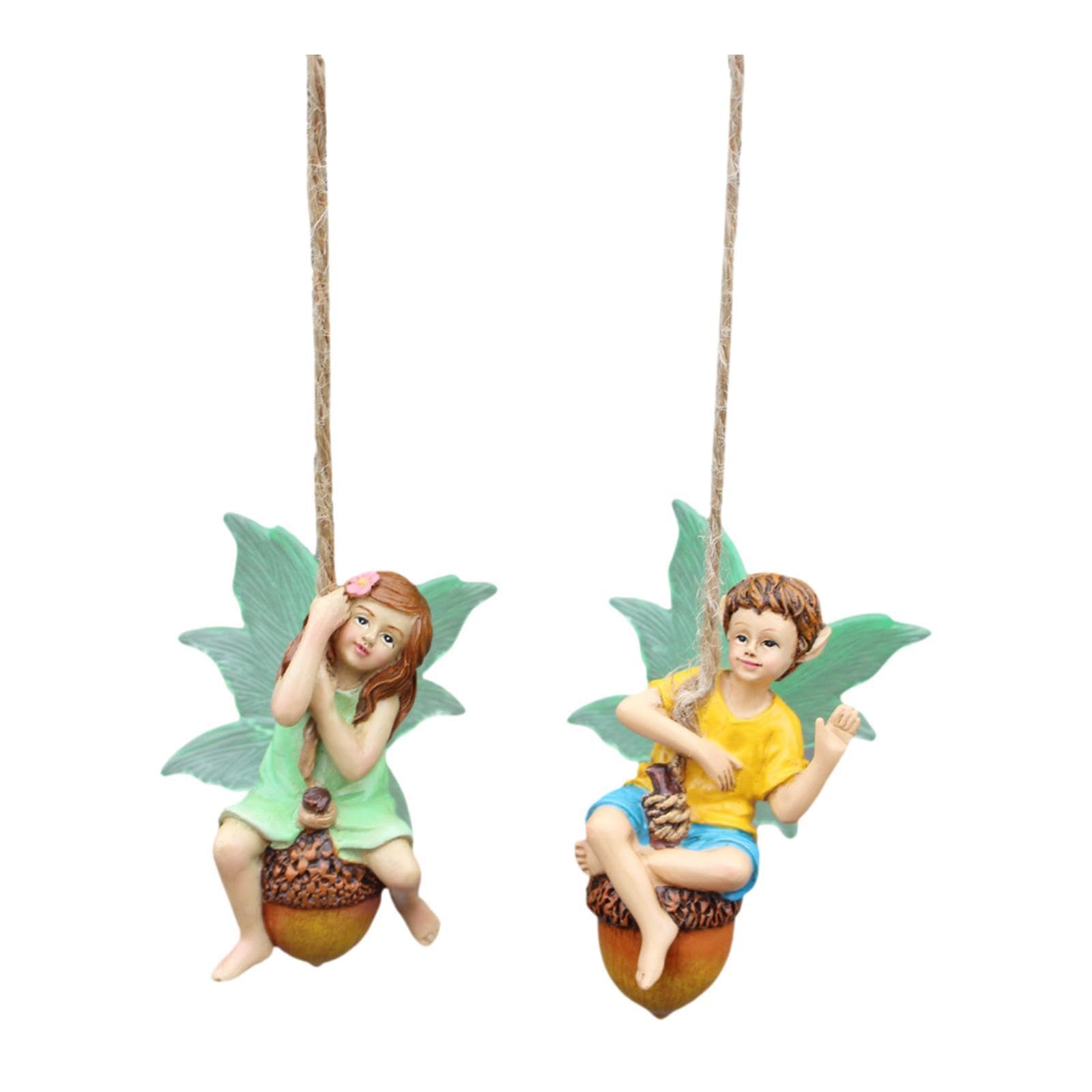 Figurines de fées de jardin sur balançoire pour combler un parterre vide