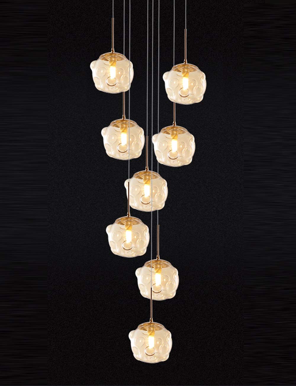 Lustre boule de verre champagne pour sublimer les hauts plafonds d'une villa ou d'un loft