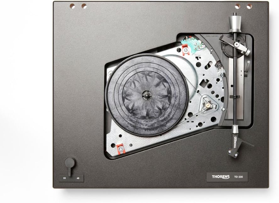 Minn fuq għal isfel view of the Thorens TD-235 turntable with the platter removed, revealing the internal drive mechanism and belt path.