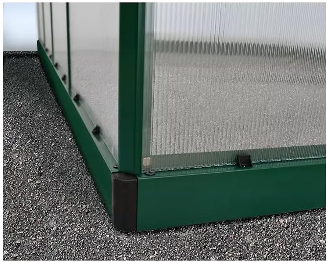 Close-up of the greenhouse door latch mechanism.