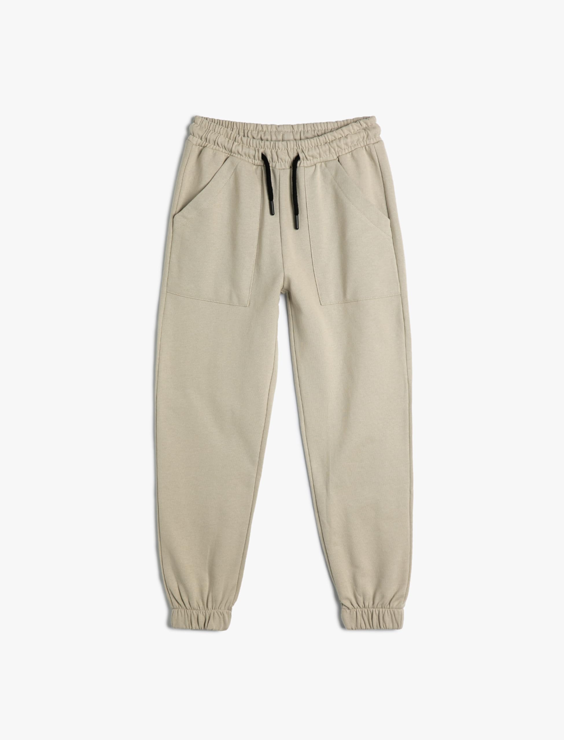 Pantalones de chándal niños de algodón en color beige con bolsillos prácticos 4