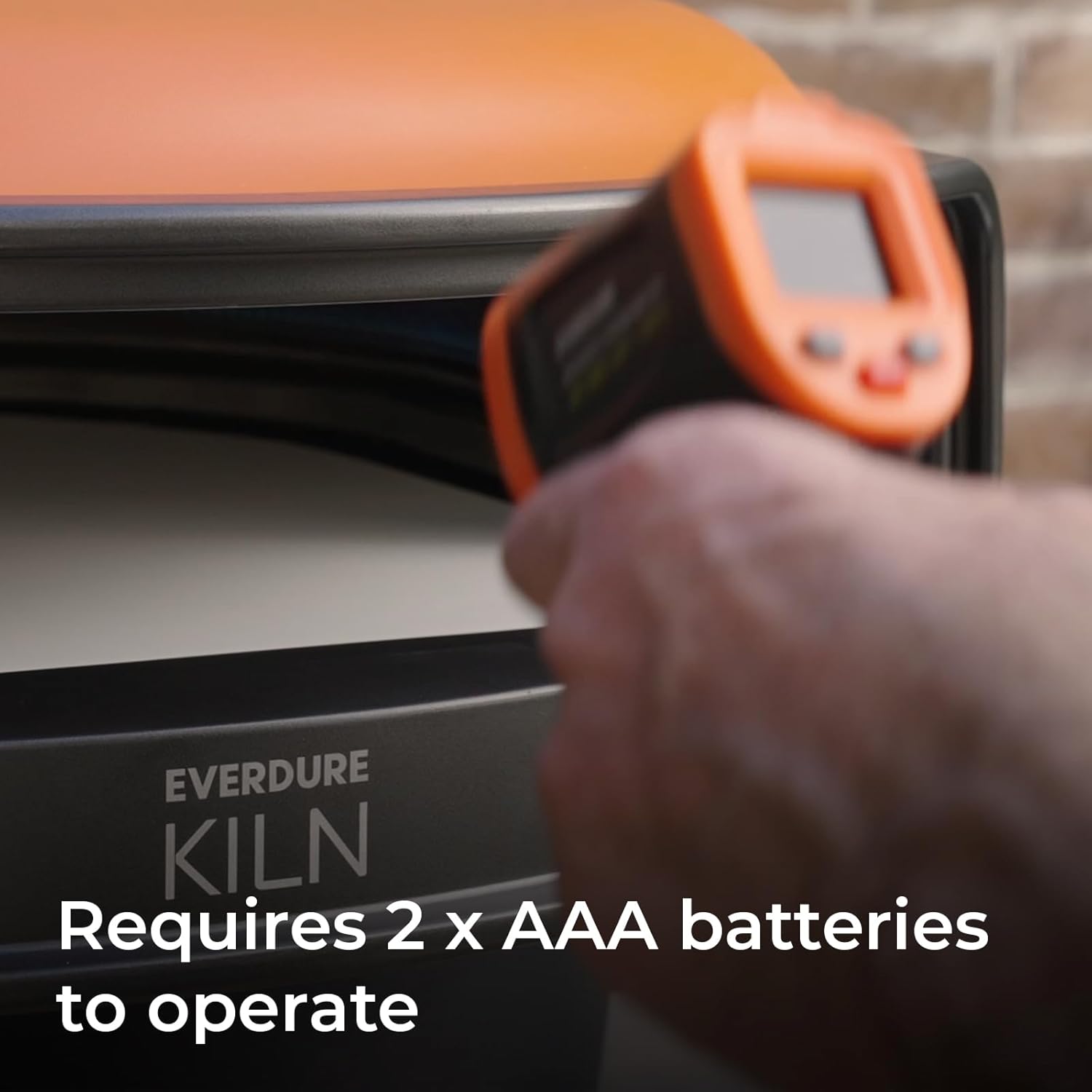 Close-up of the Everdure Infrared Temperature Gun handle, indicating it requires 2 AAA batteries.