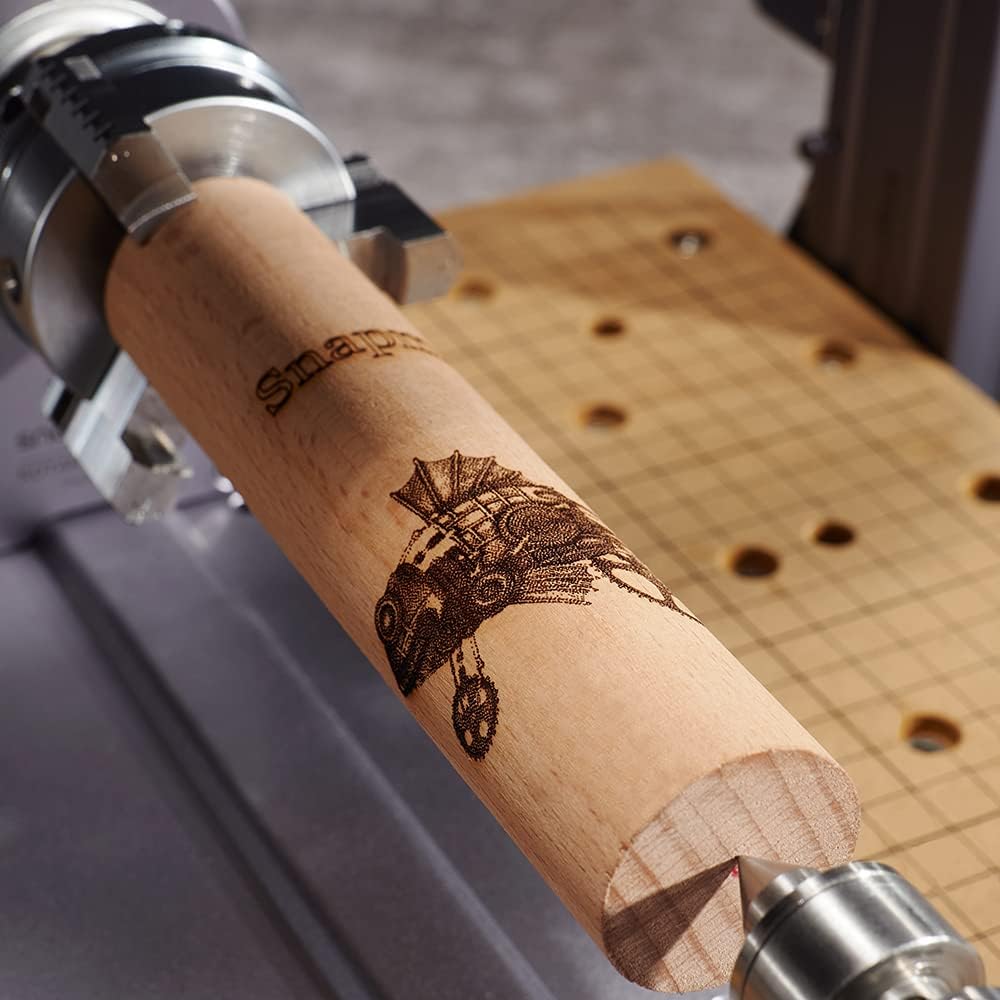Rotary laser engraving on a wooden cylinder