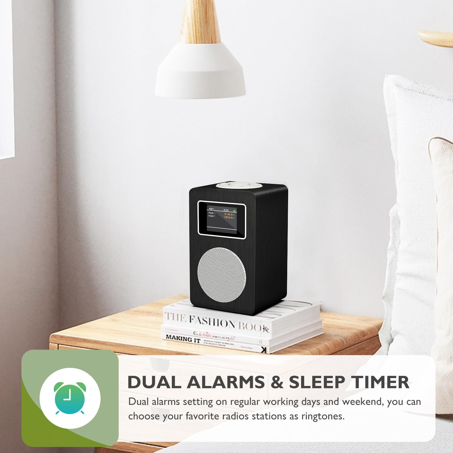 MangoKit MD4 radio on a bedside table, displaying 'DUAL ALARMS & SLEEP TIMER' with an alarm clock icon.