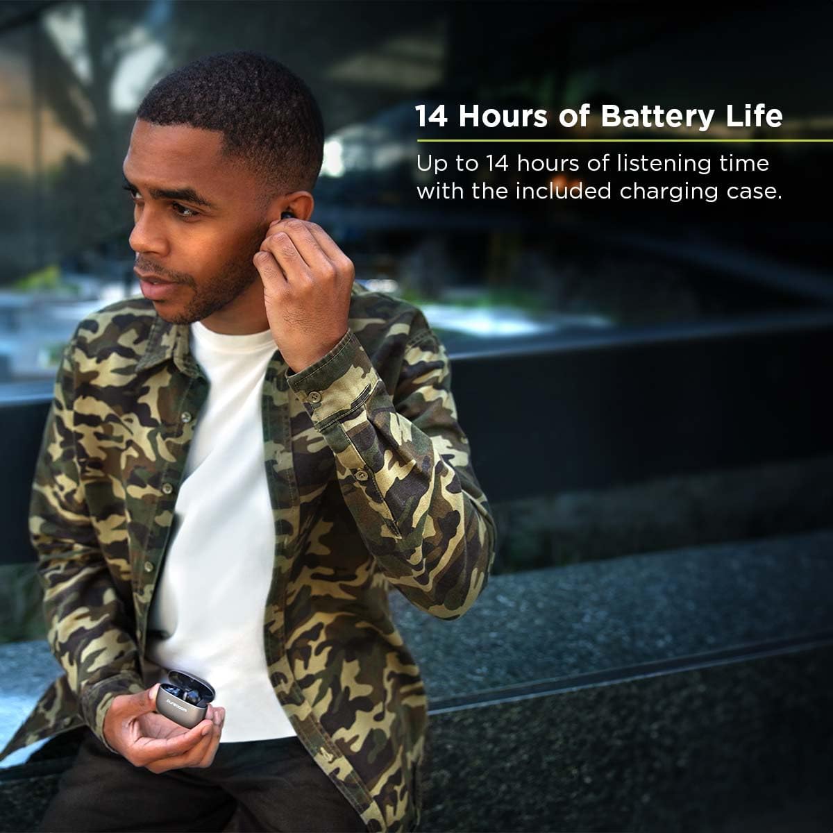 A man wearing PureGear PureBoom Orbs Pro earbuds, illustrating the 14 hours of battery life.