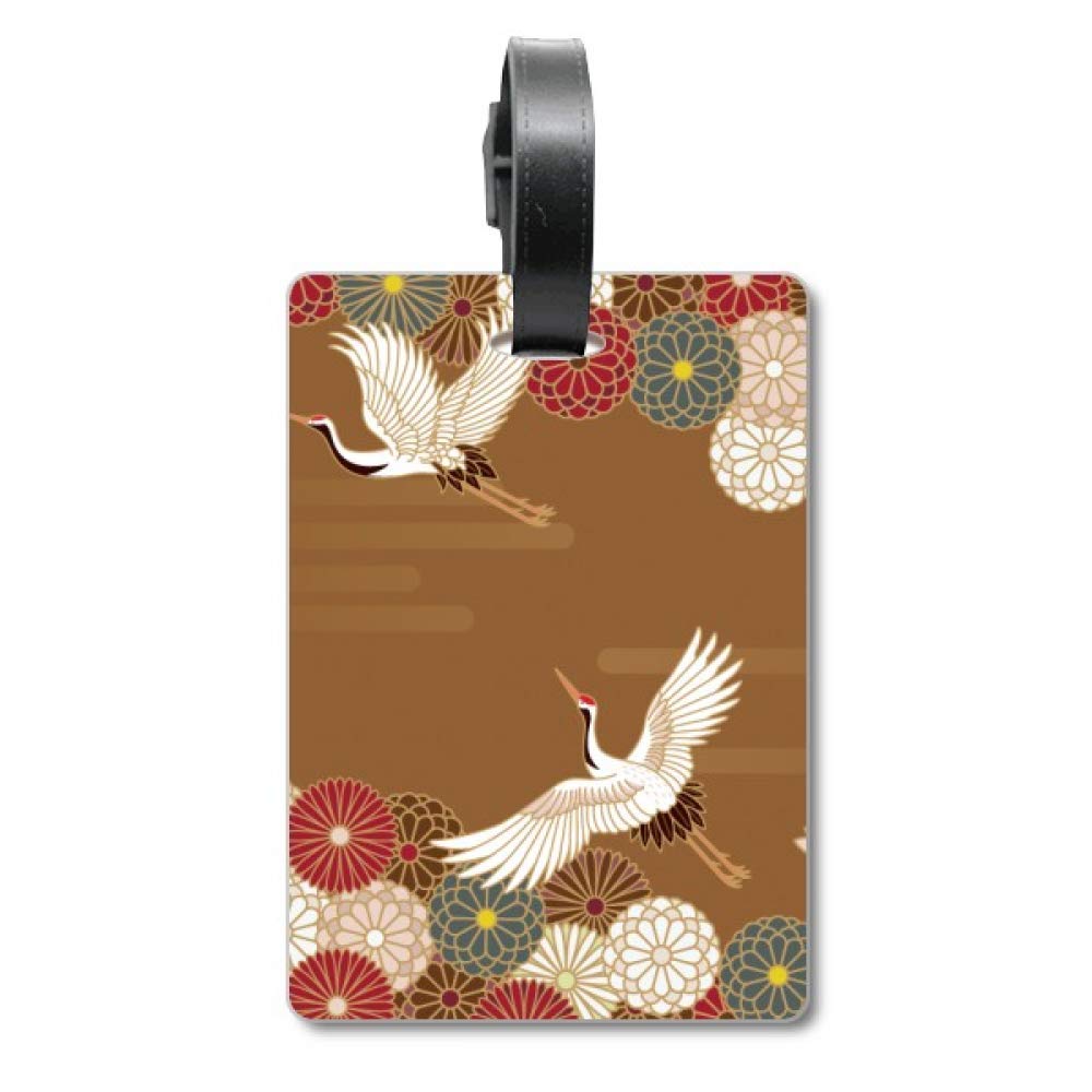 Étiquette valise fleurs grues avec motif poétique et sangle robuste