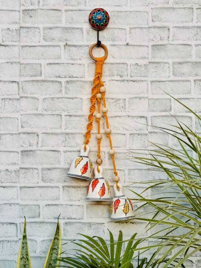 Image of Crafty Co. Decorative Wall & Door Hanging Toran with Bells for Home Entrances (Orange)- Bunch of 3 Big Bells | Macrame Wall Hanging Toran for Diwali, New Year, Festive Decoration, Balcony & Door Decor