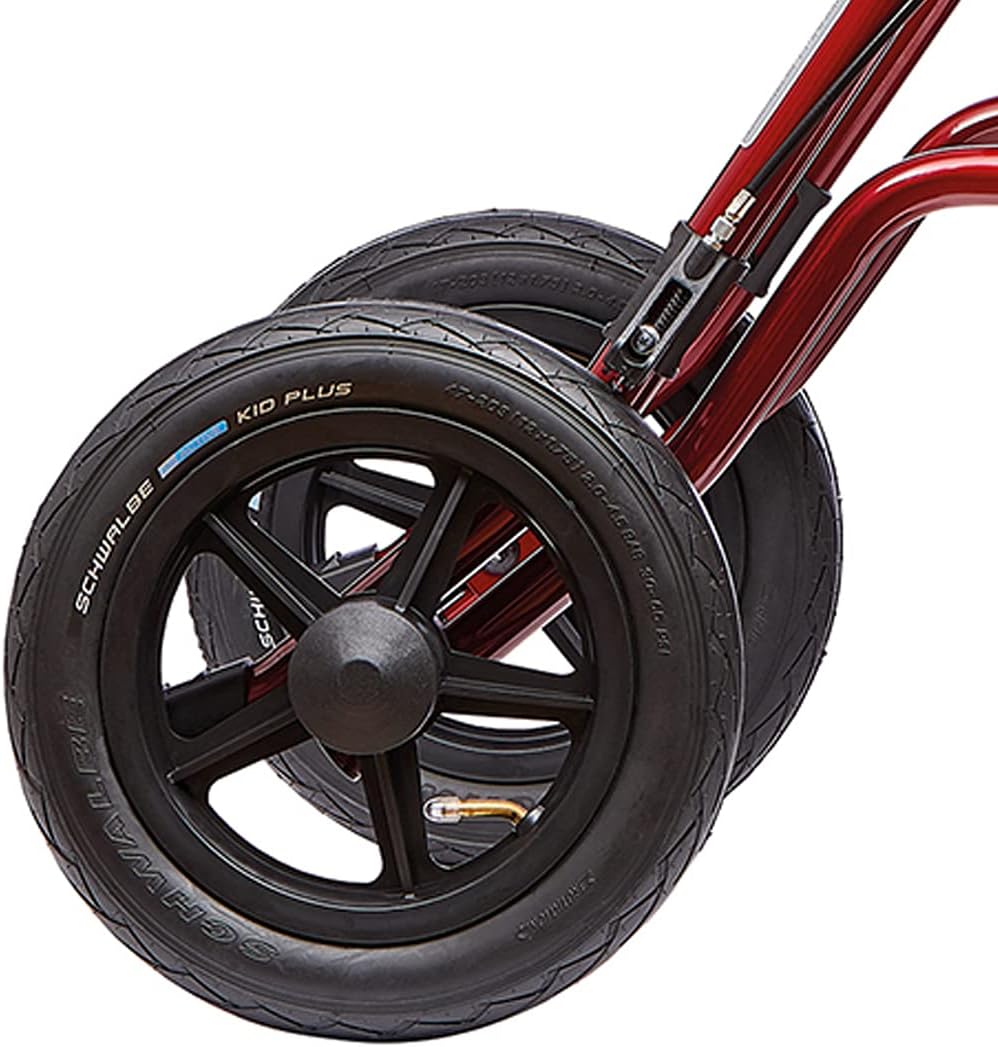 Close-up view of the large pneumatic wheel of the TAiMA XC Outdoor Rollator, showing the tire tread and valve.