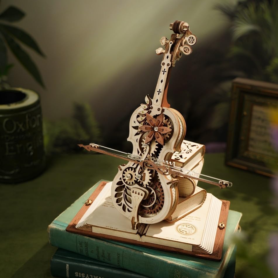 Magic Cello 3D Wooden Puzzle Music Box placed on a green surface, ready to be operated.