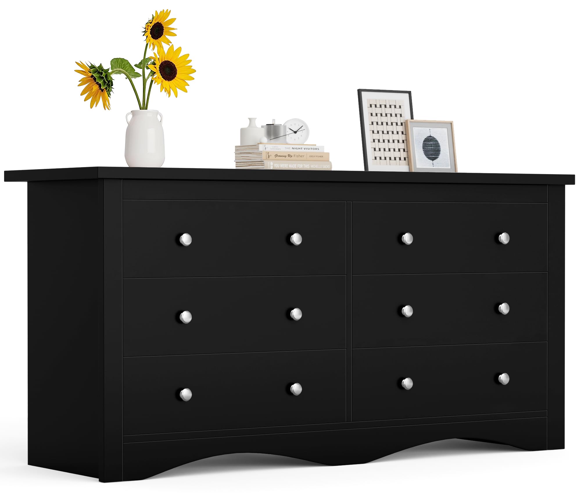 A black Furmax 6-drawer wood dresser with silver knobs, placed in a room with decorative items on top.