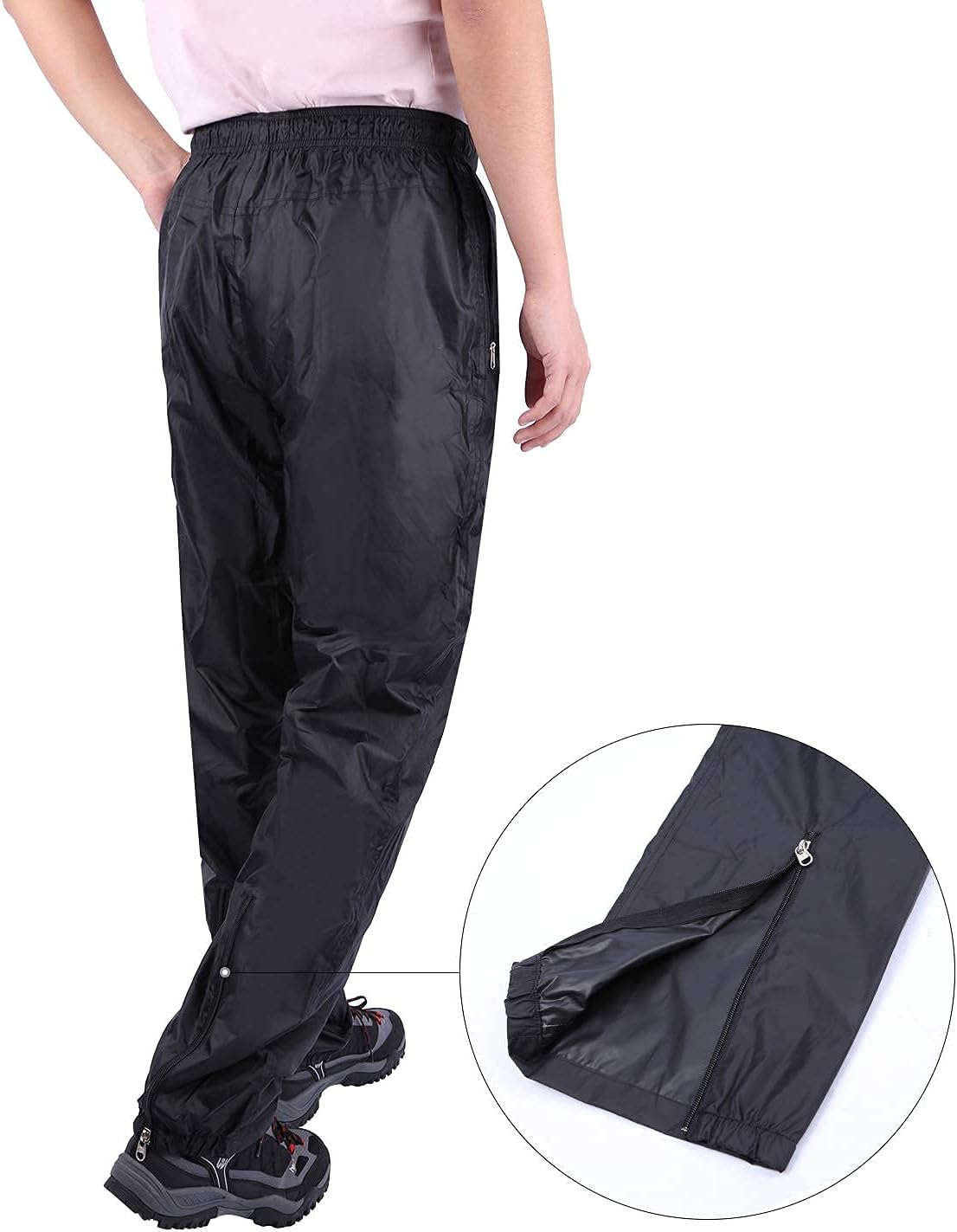 Person wearing REDCAMP rain pants, showing the side zipper at the ankle