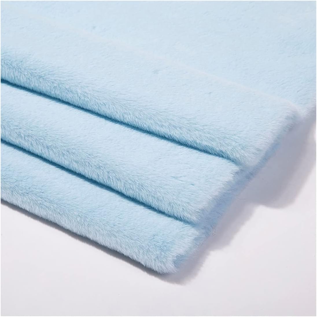 Tela de piel sintética para ropa y mantas de pelo corto en tono azul cielo