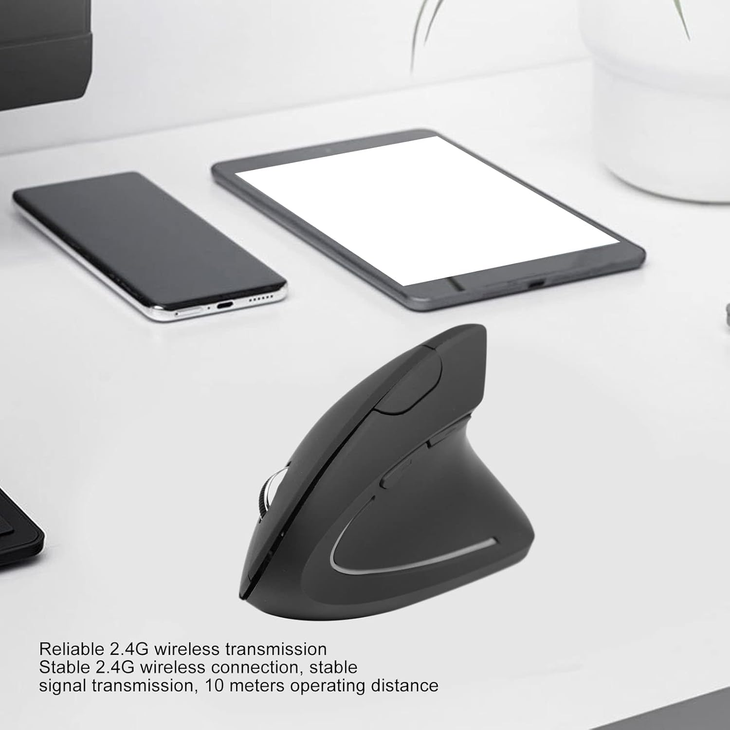 Bewinner Wireless Vertical Ergonomic Mouse on a desk with other devices