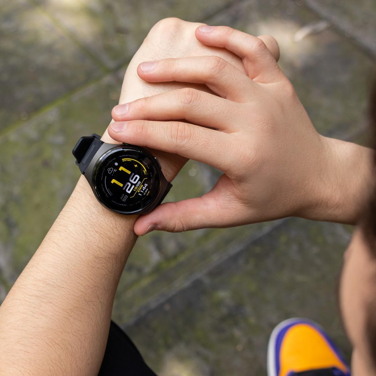 Person interacting with the STF Kronos Speed GPS Smartwatch display