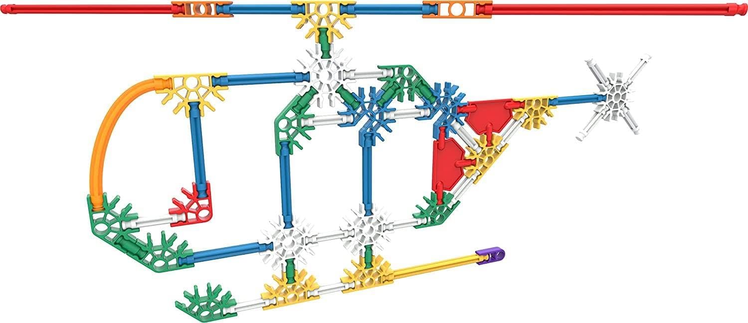 Two children actively building with K'NEX pieces