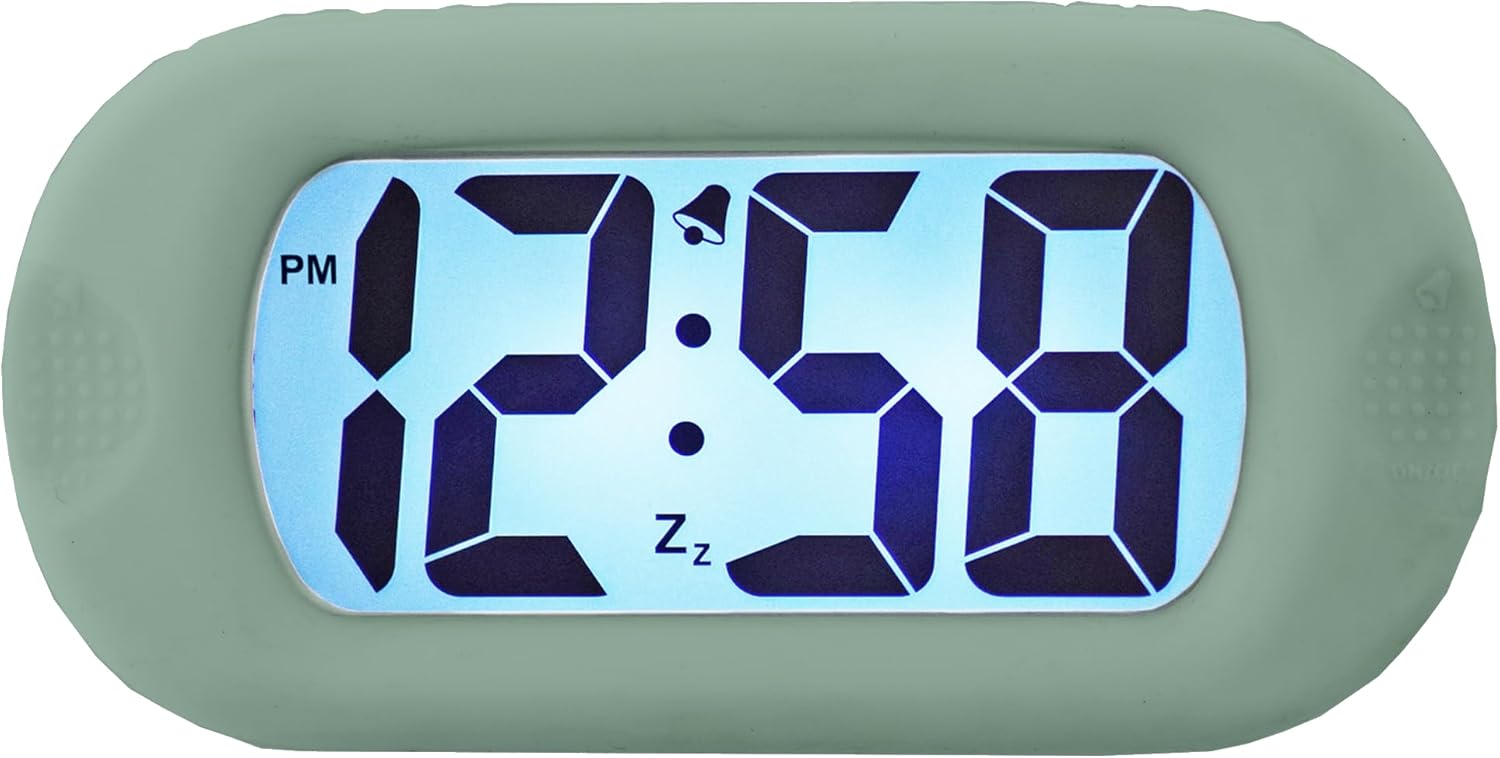 Depan view of the Acctim Pale Green Silicone Digital Alarm Clock showing the large digital display with time 12:58 PM, an alarm bell icon, and a snooze icon.