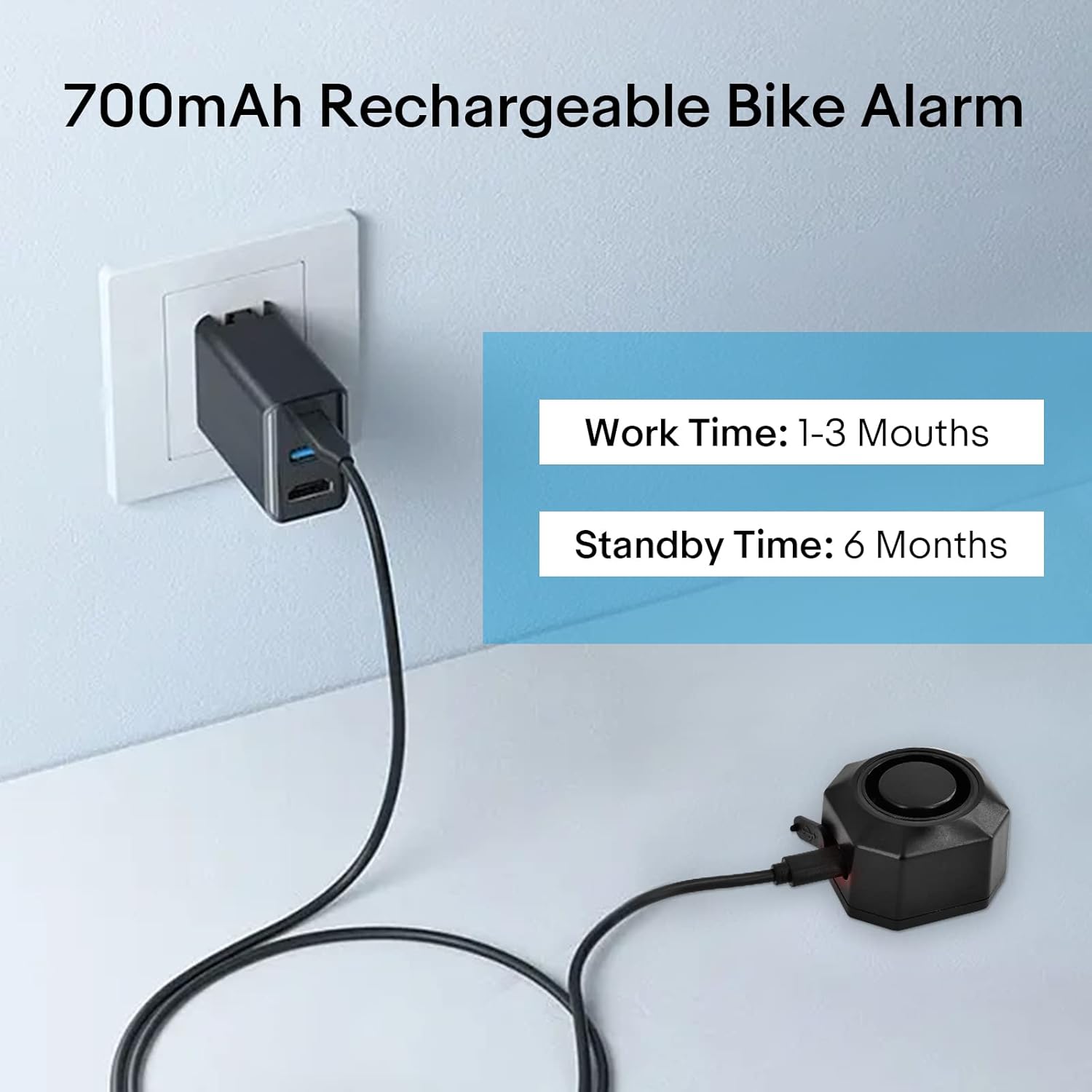 NineLeaf Bicycle Anti-theft Alarm being charged via USB-C cable from a wall adapter