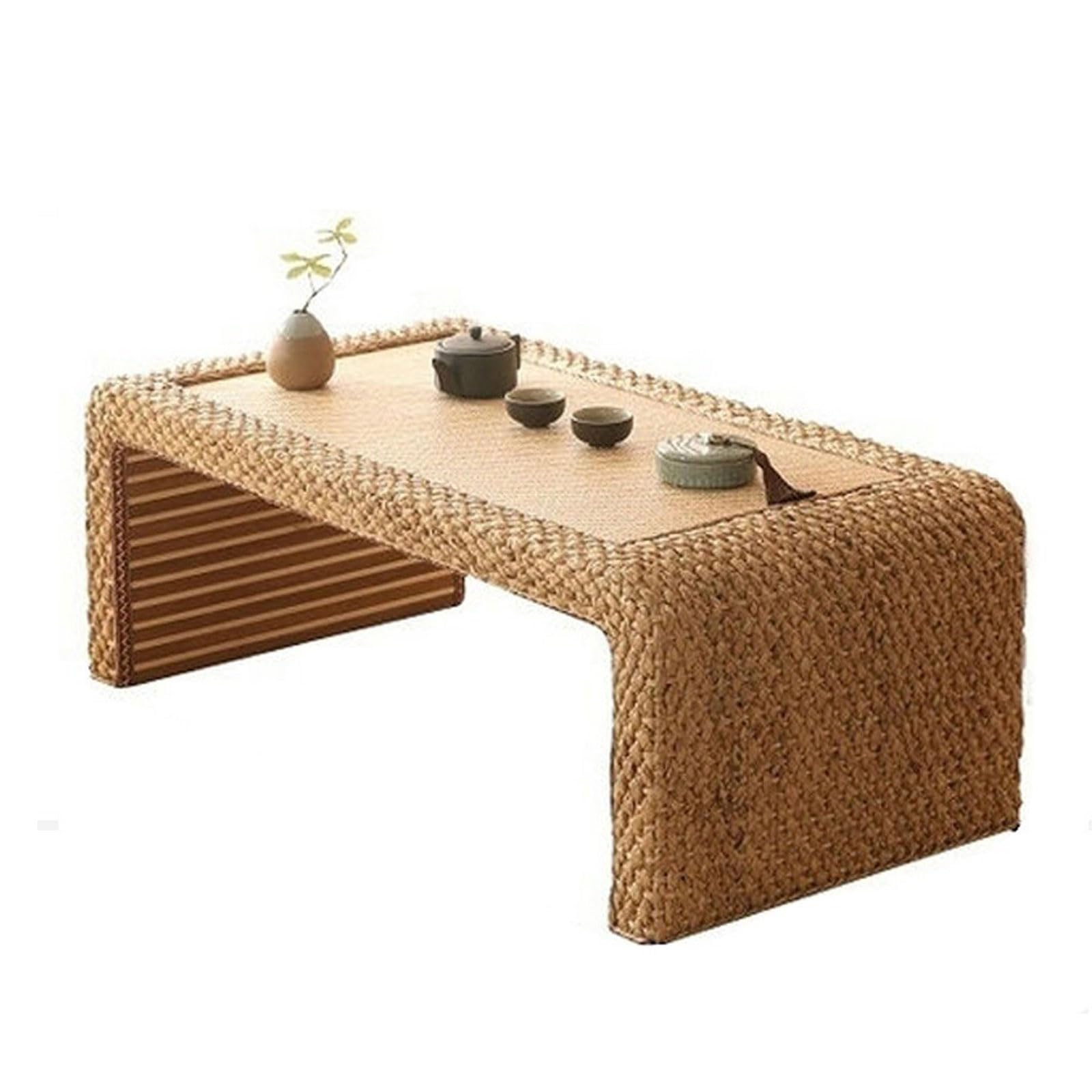 Table basse en rotin pour créer un coin lecture zen sur votre baie vitrée de chambre