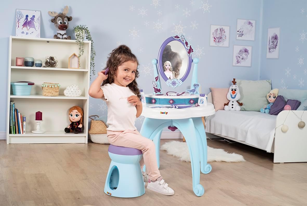 Child happily playing with the assembled Smoby Pretend Dress Up Vanity Table in a bedroom setting.