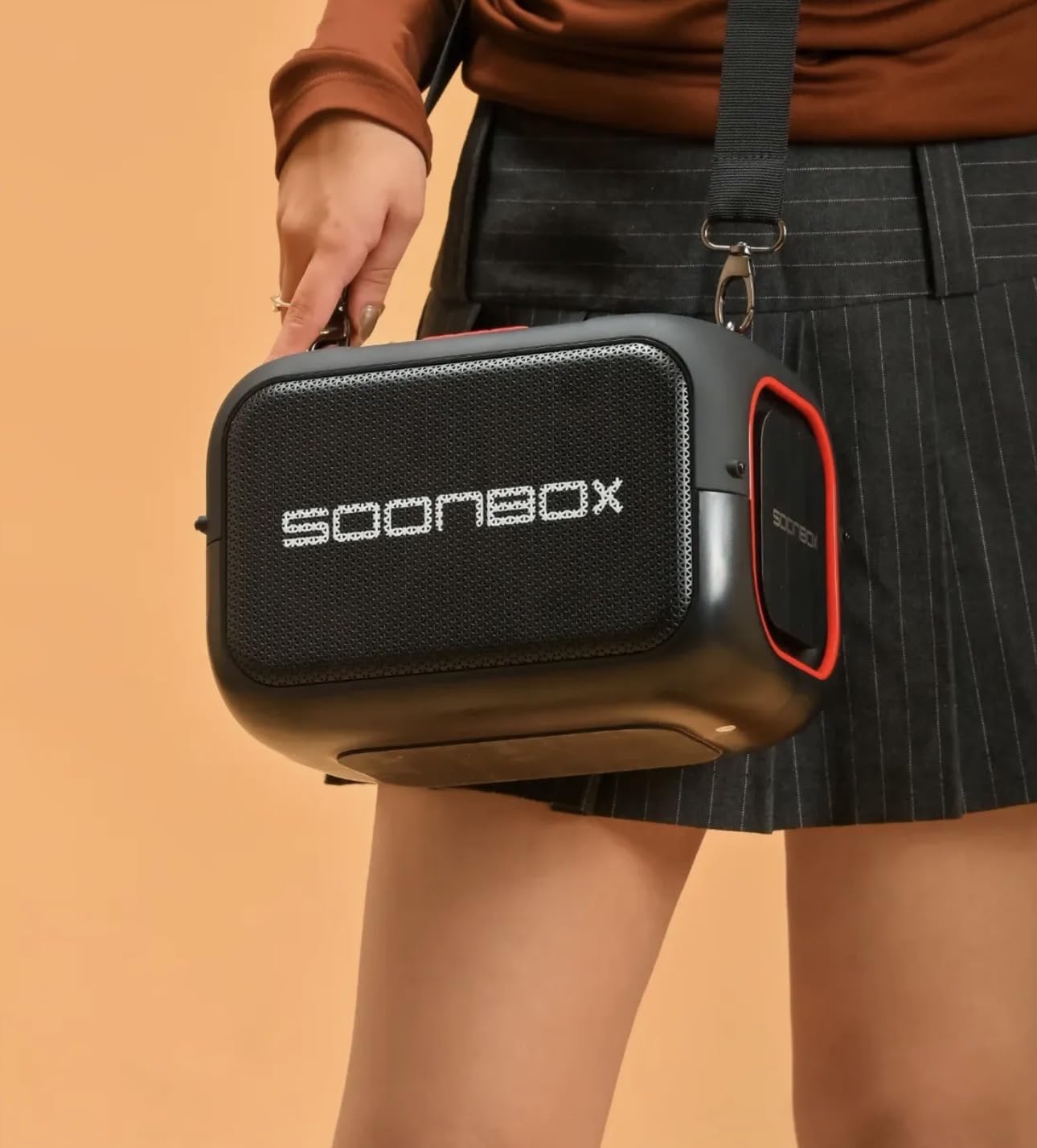 SOONBOX S3000 Black Speaker with Shoulder Strap on a person