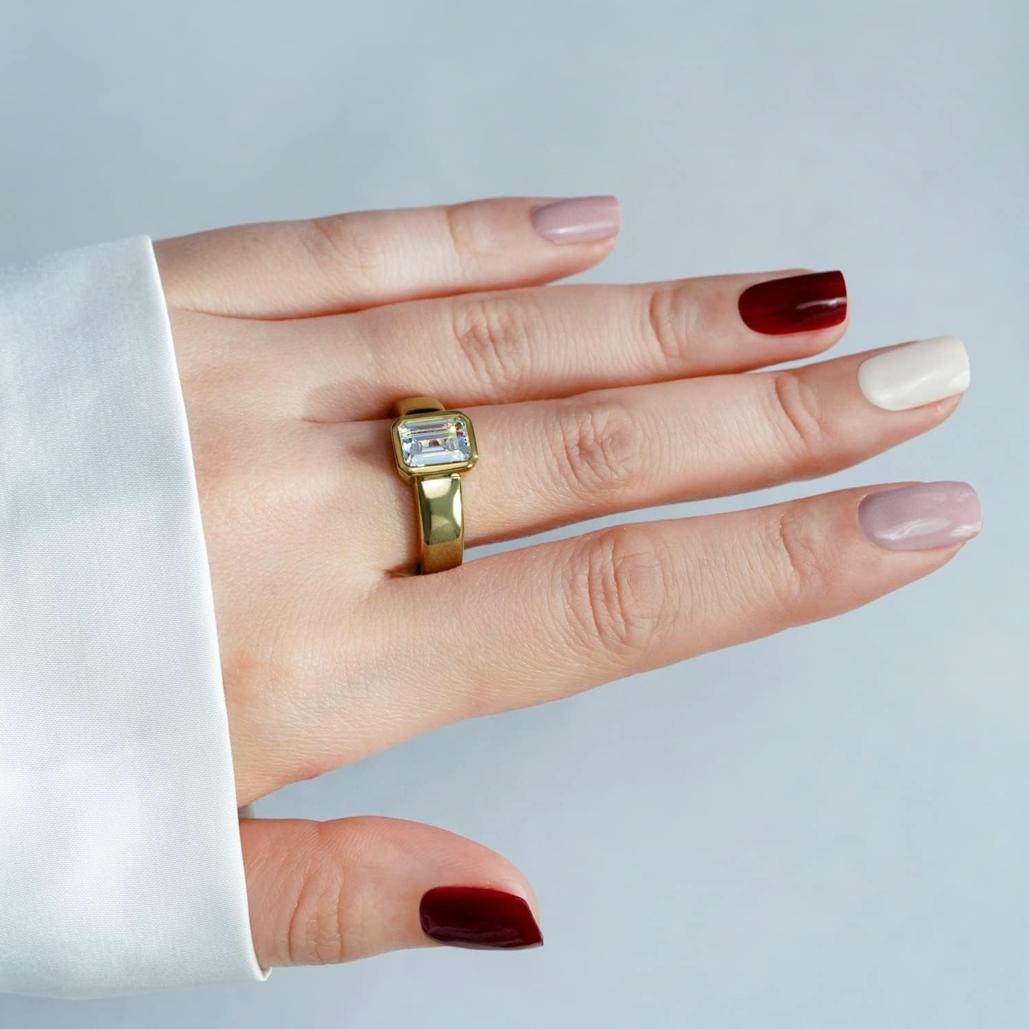 DIAMONBLISS Yellow Gold Plated Sterling Silver Clear Emerald Cubic Zirconia Bezel Engagement Ring