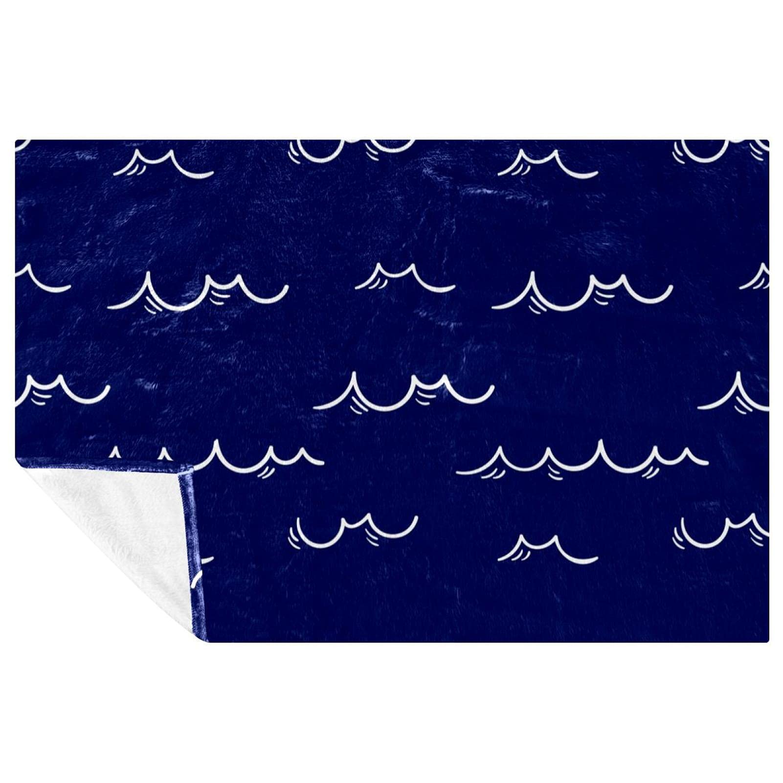Couverture motif vagues pour cocooning sur canapé et pique-nique