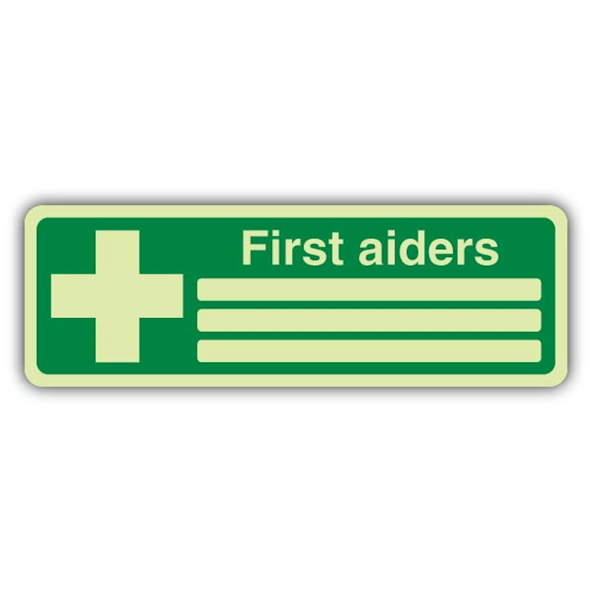 V Safety First Aiders Sign – 600 x 200 mm – Double Glow rigido