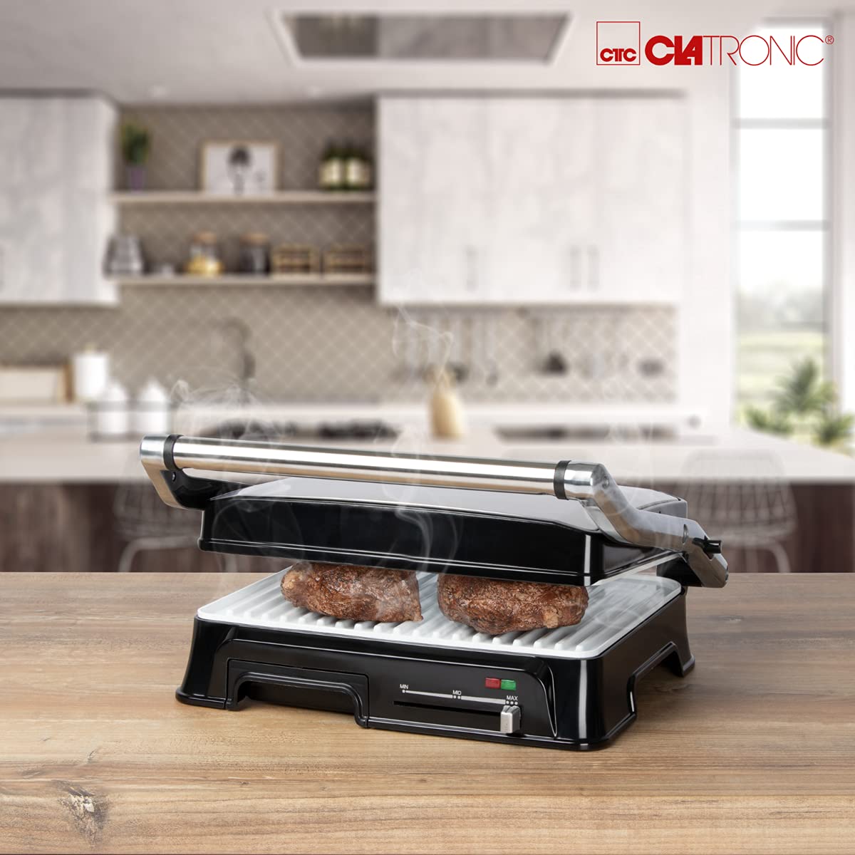 Clatronic KG 3571 grill kontaktowy do dwustronnego grillowania, 2000 W, obudowa ze stali nierdzewnej, krótkie czasy gotowania, rynna odpływowa tłuszczowa i tacka zbierająca, kolor srebrny