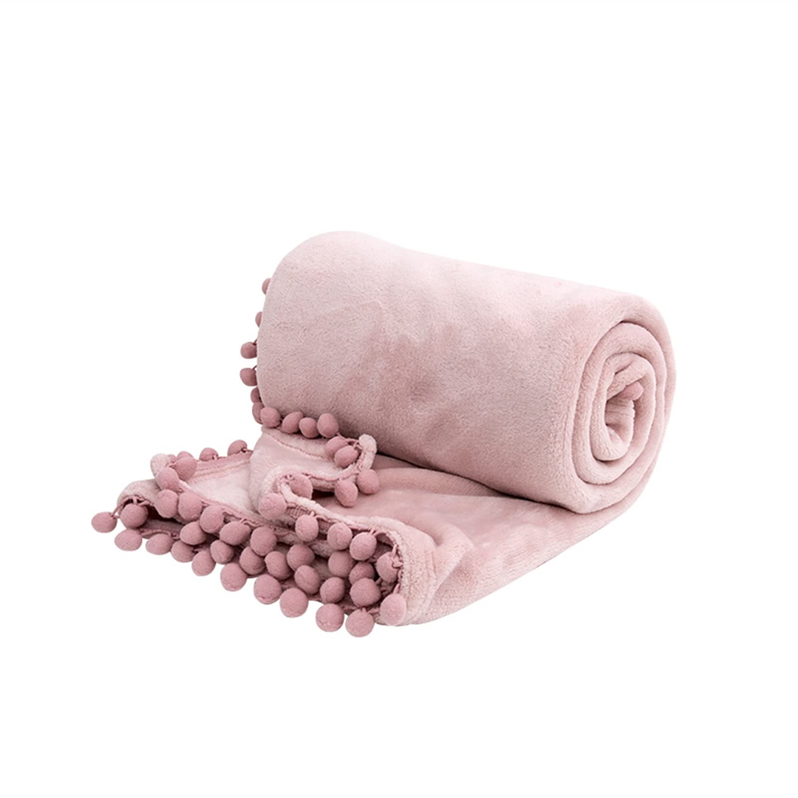 Couverture de luxe avec tassels pour cocooning sur le canapé du salon