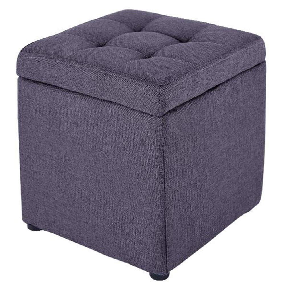 Pouf de rangement en tissu noir idéal pour un bout de lit de chambre