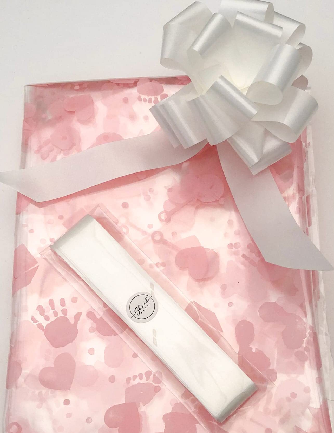 ShredAstic® Baby Print Pink Florist Cellophane wrap with 30mm Pull Bow (5 metres, white)