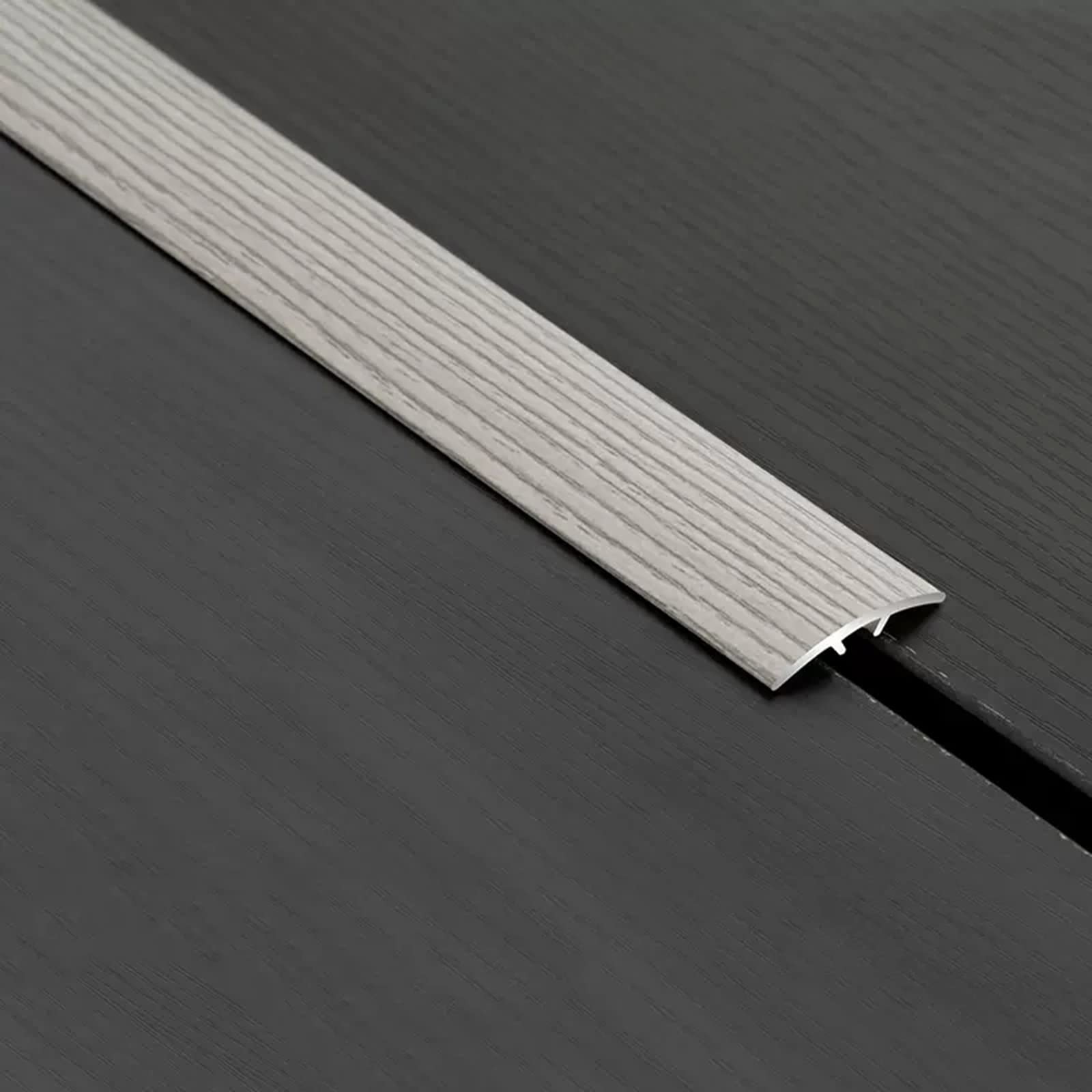 Seuil de transition sol vinyle et stratifié pour joint de porte cuisine