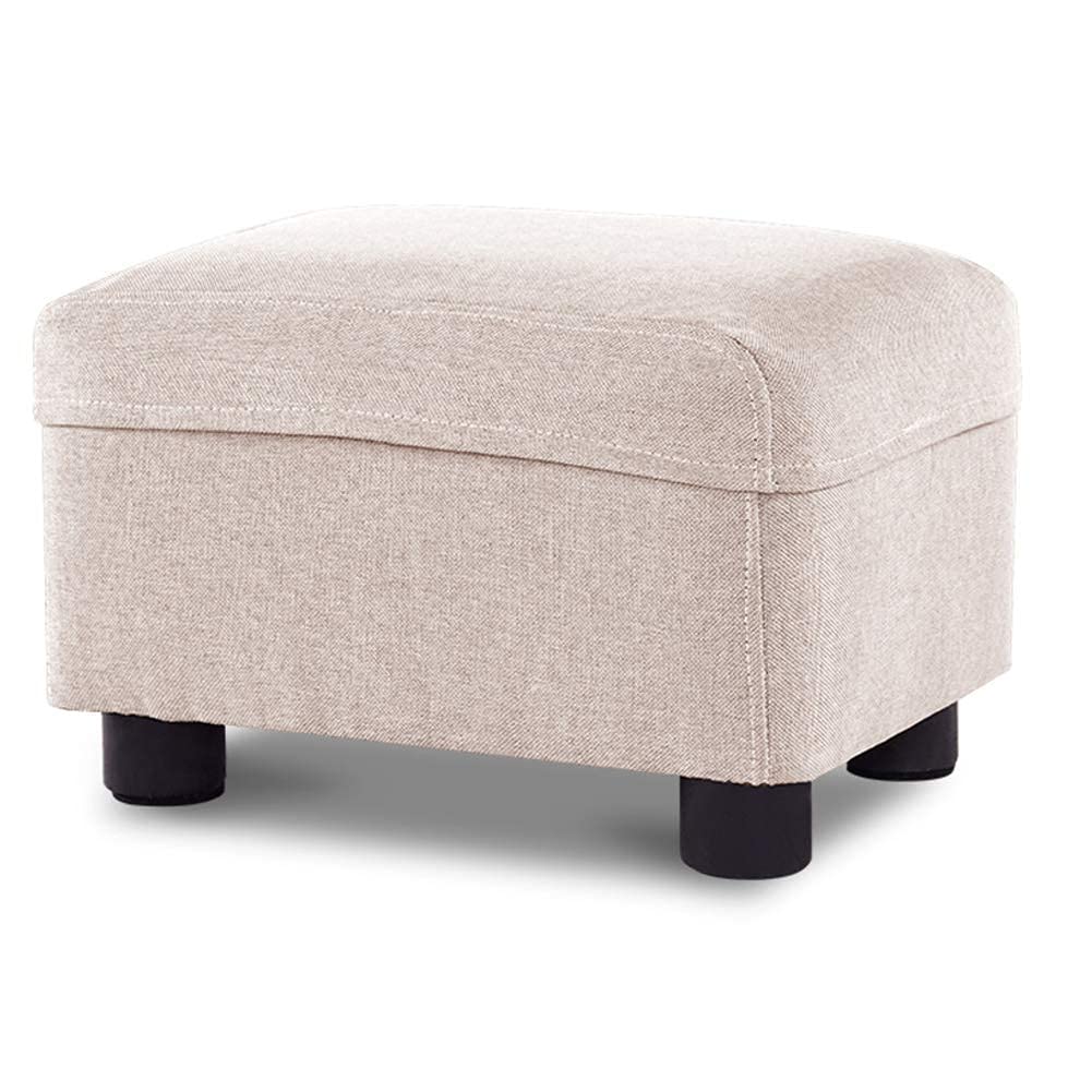 Pouf repose-pieds beige sous le bureau pour soulager vos jambes en télétravail