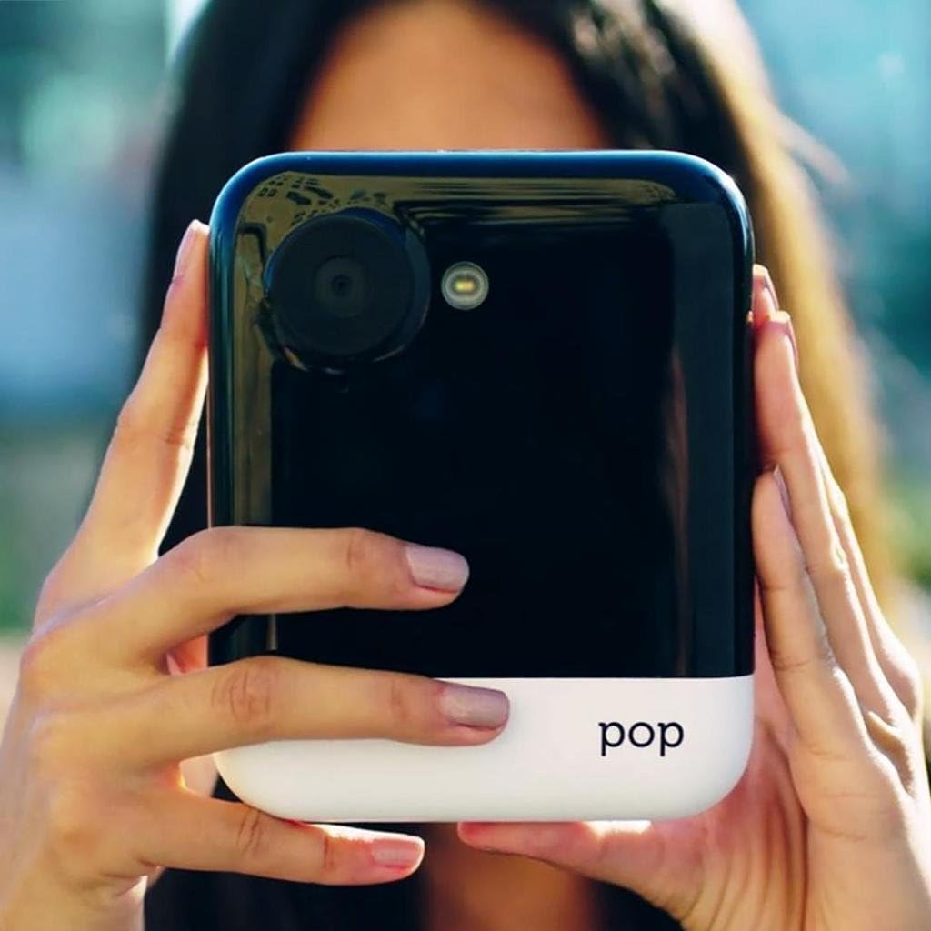 Person holding Polaroid Pop camera to take a photo