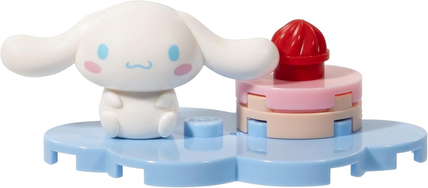 Close-up of My Melody minifigure with a strawberry drink accessory on a blue display base