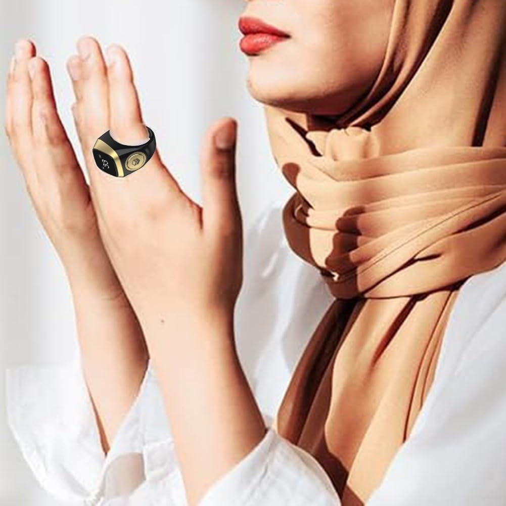 Multiple IQibla Smart Zikr Rings in various colors, with a charging cable shown at the bottom right.