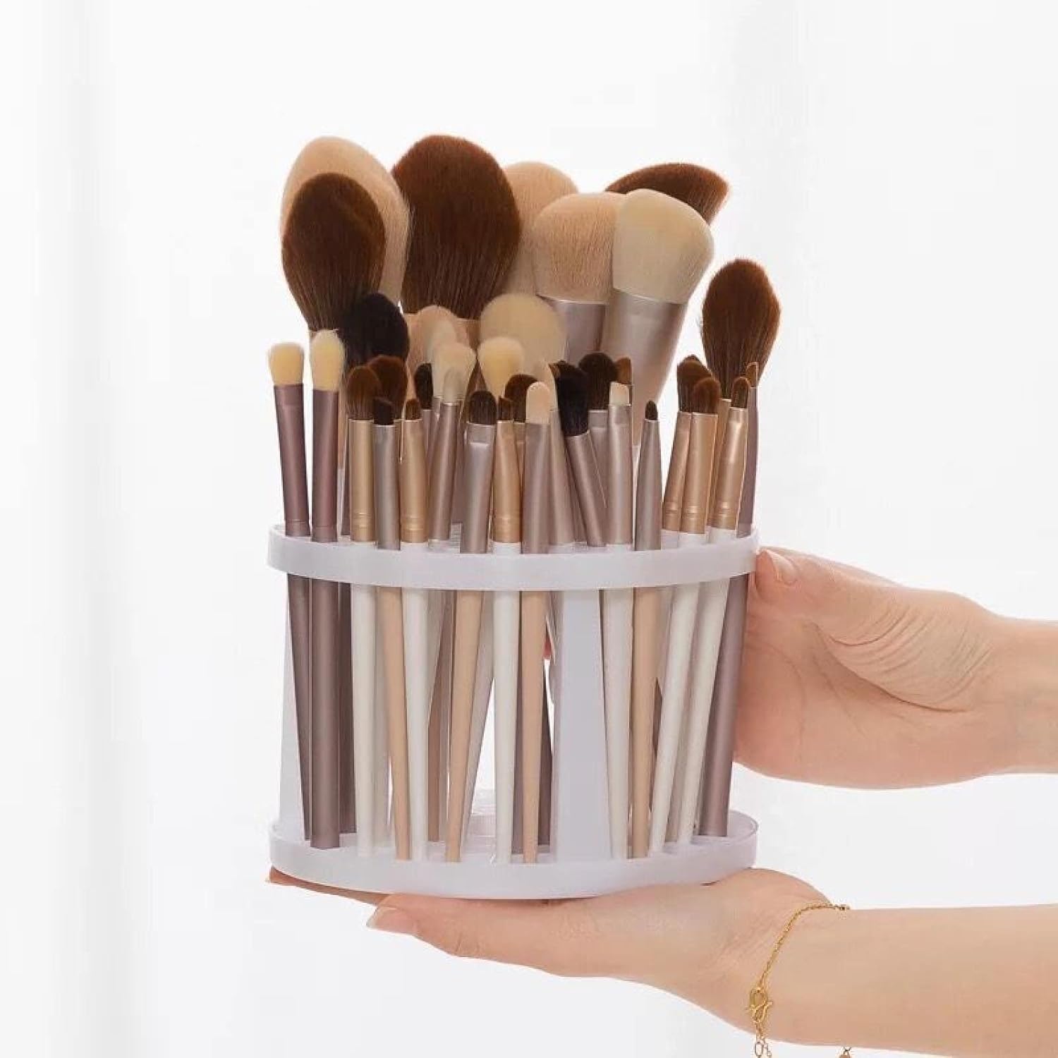 Hands holding SONLED organizer filled with brushes