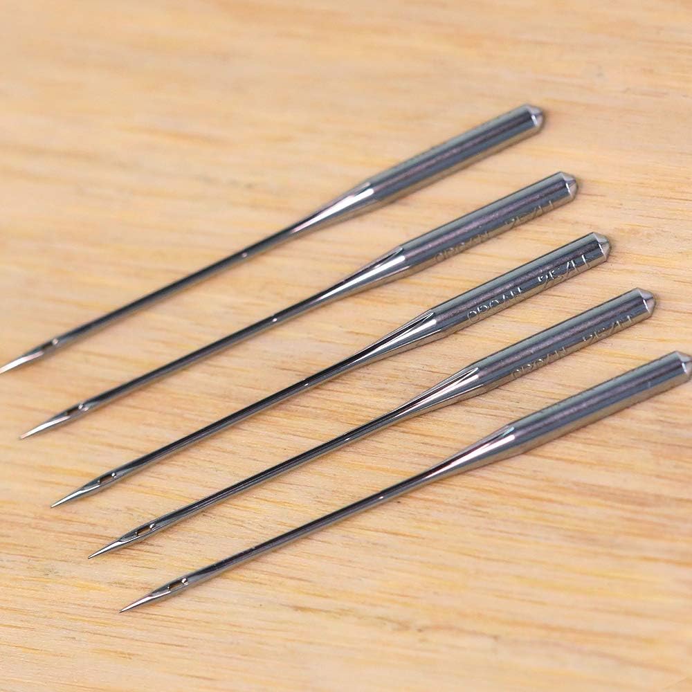 Four large cones of neutral-colored serger thread