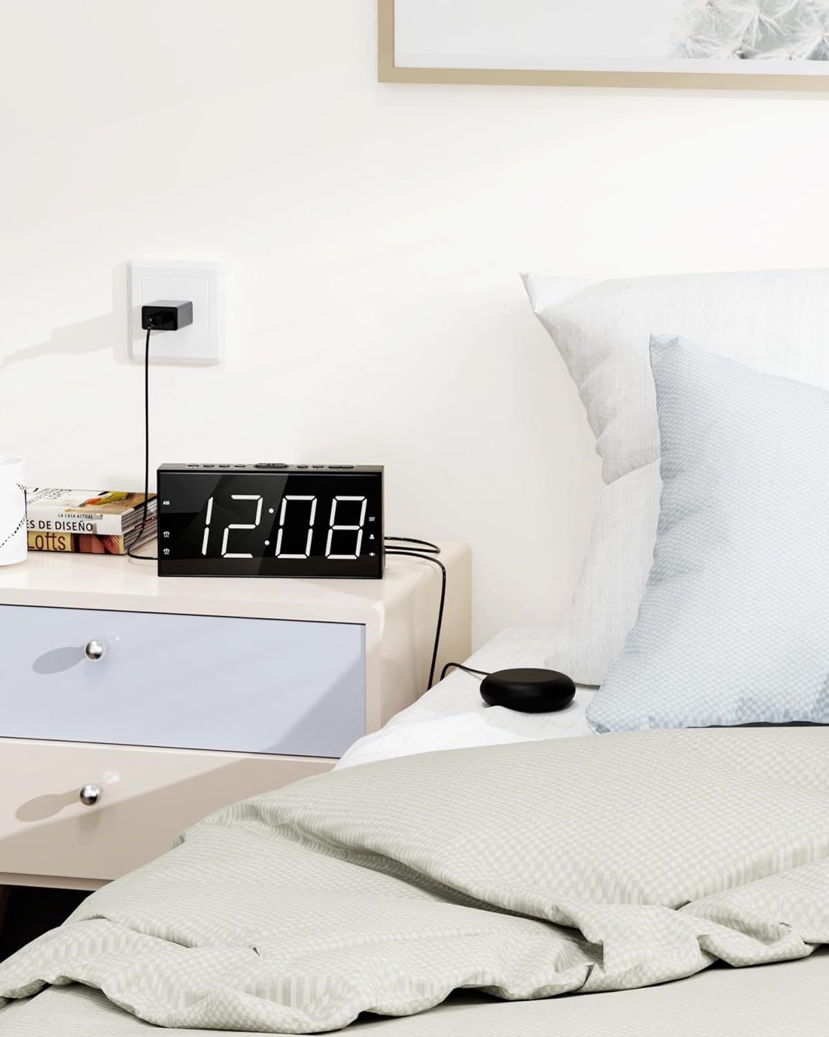Alarm clock placed on a bedside table in a bedroom setting