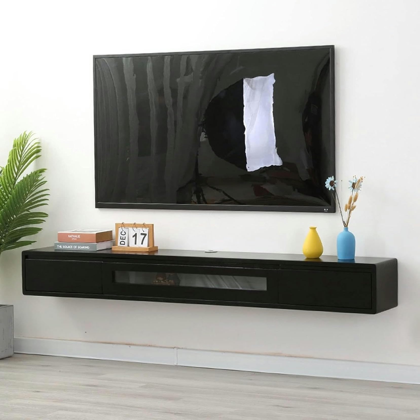 Armoire à télévision flottante en bois massif noir de 140 cm pour un salon moderne