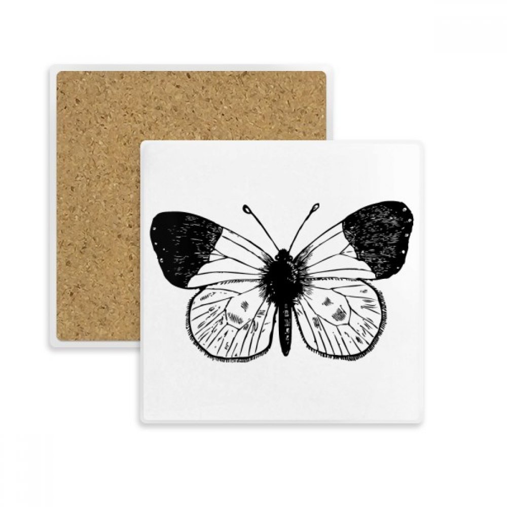 Dessous de verre carré en pierre absorbante avec motif ailes de papillon blanc