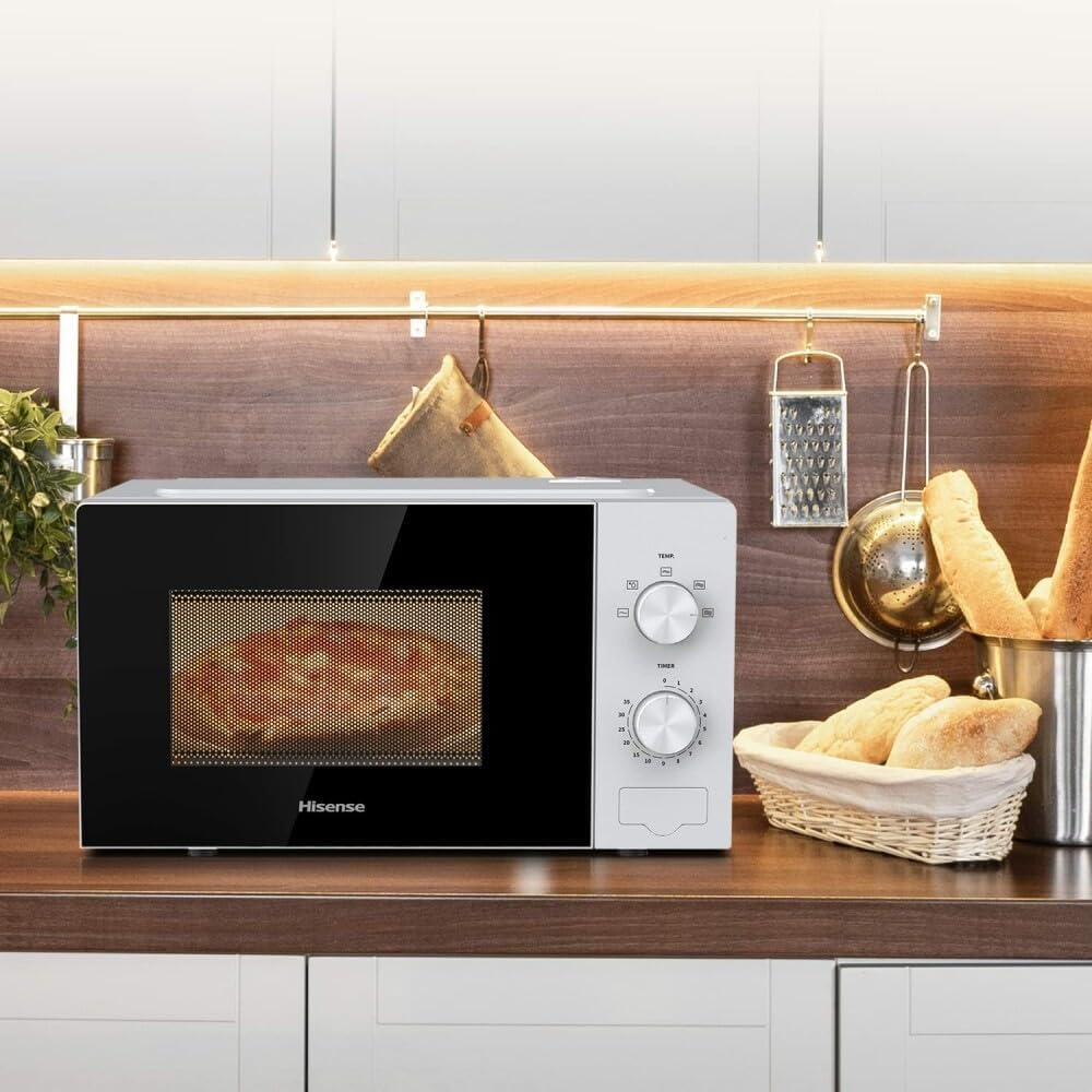 Hisense H20MOWP1 Microwave Oven on a kitchen counter with food inside
