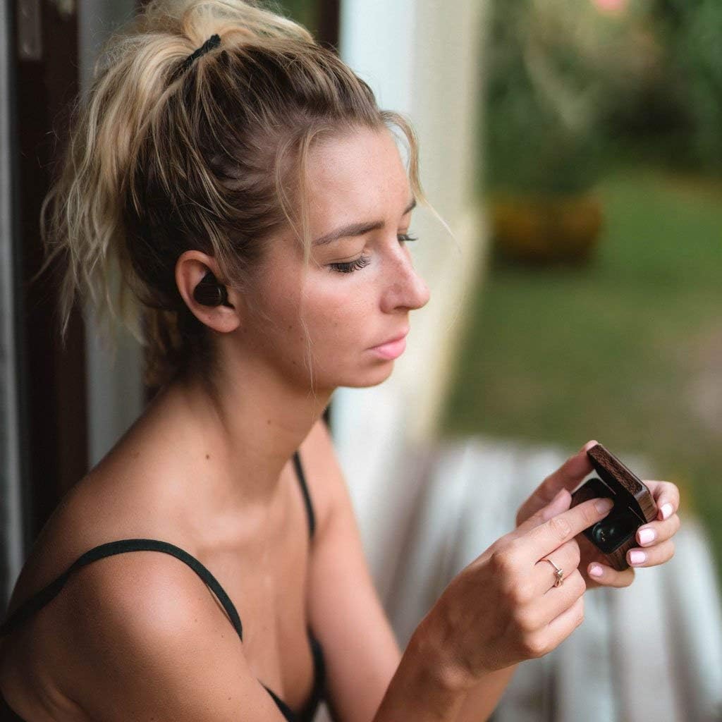 User wearing Reveal TWS earbuds