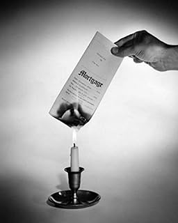 Posterazzi Studio shot of hand burning mortgage document over candle flame Poster Print, (18 x 24)