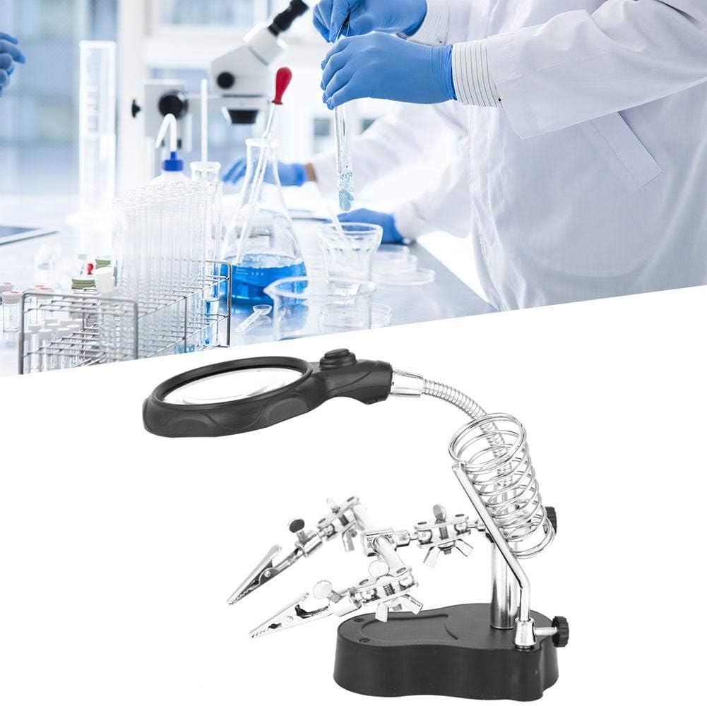 Jectse TE-801 Helping Hands Magnifying Repair Stand in use, showing the magnifying glass and clips holding an object.