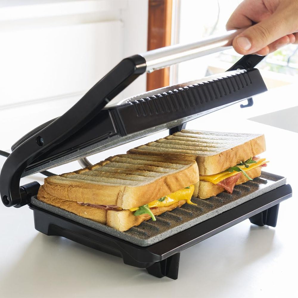Cecotec Griglia elettrica con Grill Rock'n Grill. 700 W, superficie 23 x 14,5 cm, RockStone antiaderente, senza PTFE, PFOA, piastra galleggiante, maniglia fredda al tatto, indicatore luminoso
